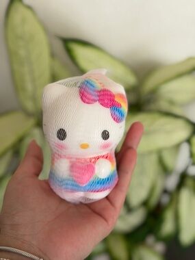 White Plush Character with Rainbow Bow and Heart